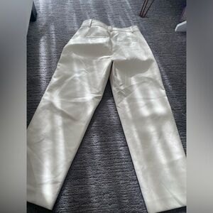 Cream, leather pants